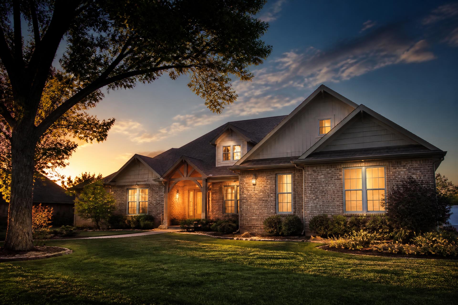 Warm Oklahoma family home lit up at golden hour